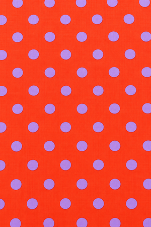 Orange printed dress material with purple dots