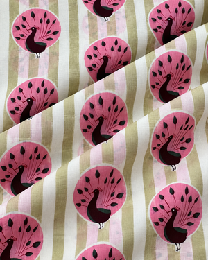 Elegant pink peacock printed cotton fabric for sewing and dressmaking projects.