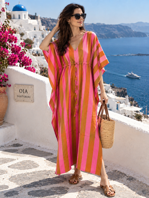 Full-length pink and brown striped vacation kaftan dress