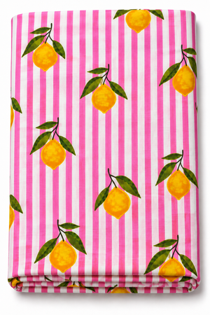 Pink and white striped lemon print fabric with yellow citrus and green leaves
