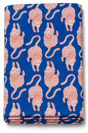 Blue Tibetan tiger print fabric with white motifs