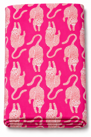 Pink Tibetan tiger print fabric with white motifs