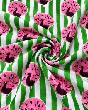 Colourful pink peacock bird print cotton fabric for sewing projects.