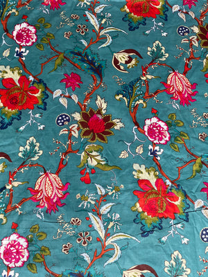 Colorful vintage botanical cotton fabric on teal background