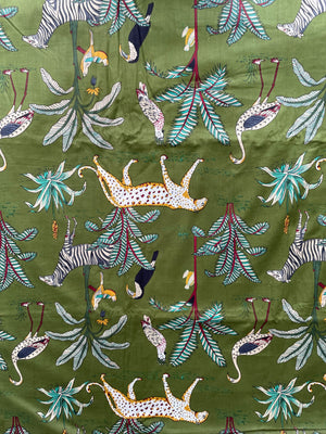 Jungle wildlife cotton fabric with tropical foliage
