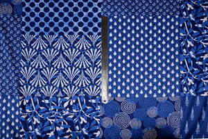 Blue abstract fabric with dots and circle motifs