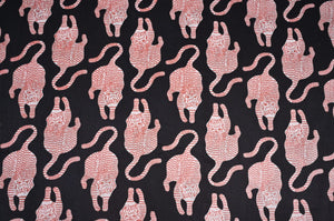 Black tiger print Indian fabric with red details
