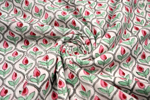 Pink floral block print cotton fabric with green leaves