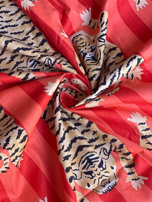 Tiger print fabric with red striped background