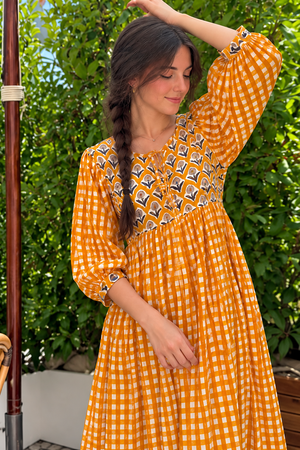 Orange and white checkered dress with decorative printed chest panel