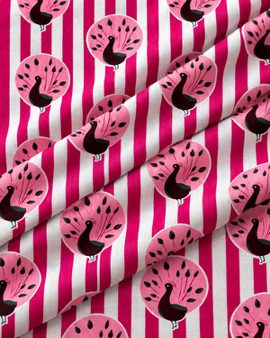Colourful pink peacock printed cotton fabric for sewing and dressmaking.