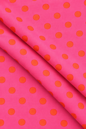 Hot pink and orange printed textile for sewing and DIY craft projects
