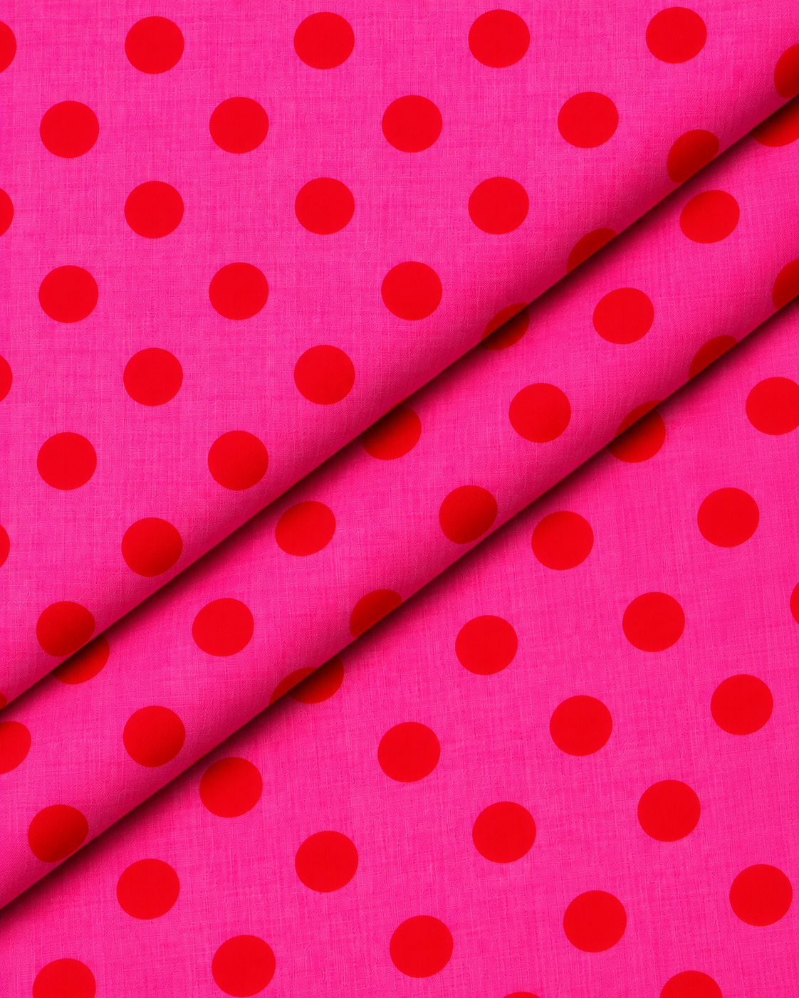 Red polka dot pattern on hot pink textile