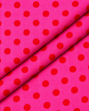 Red polka dot pattern on hot pink textile