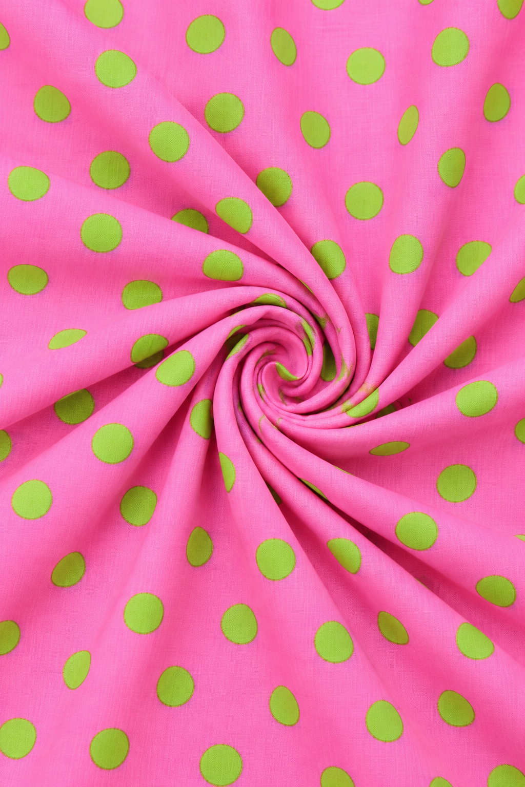 Pink and green polka dot fabric close up texture