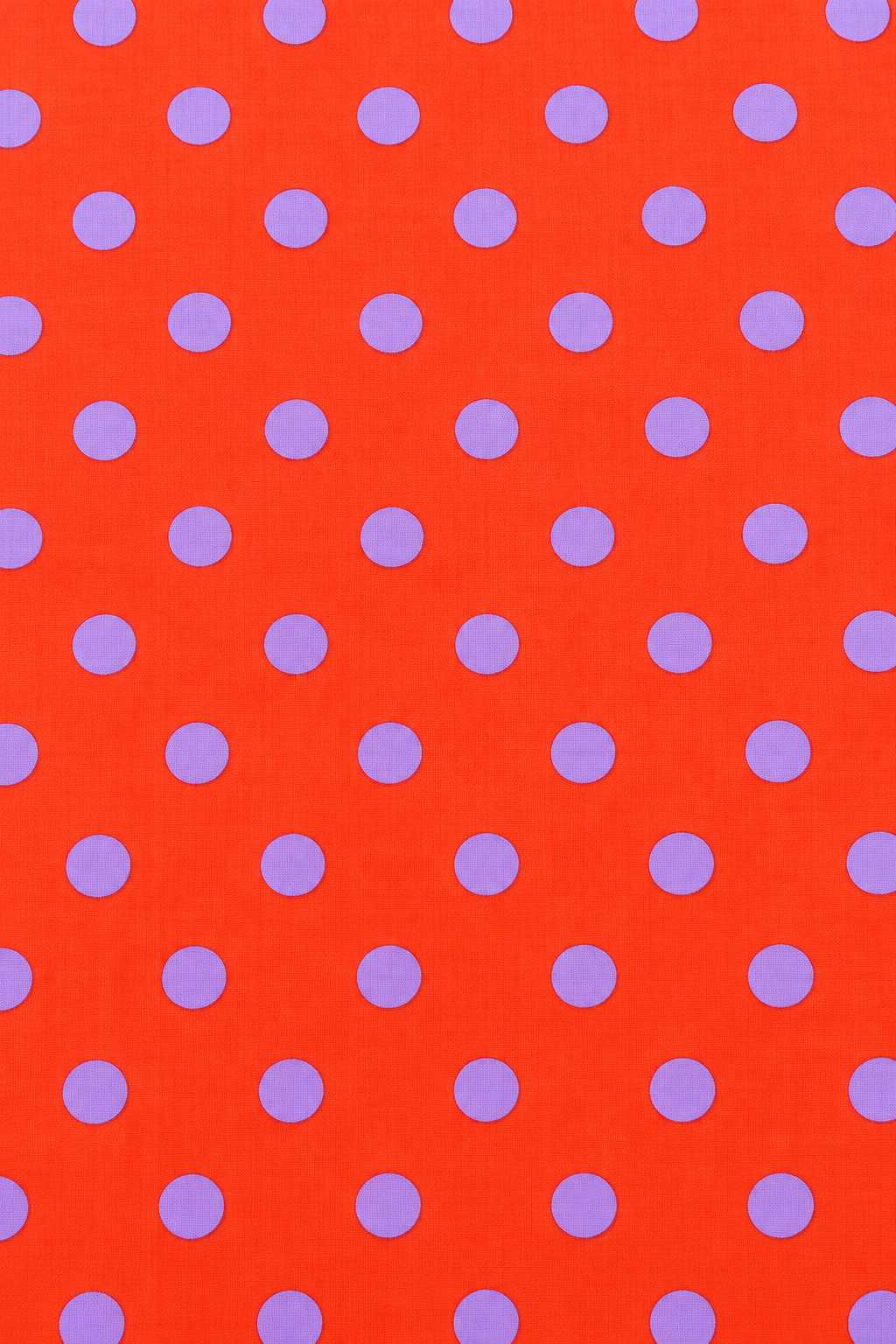 Orange printed dress material with purple dots