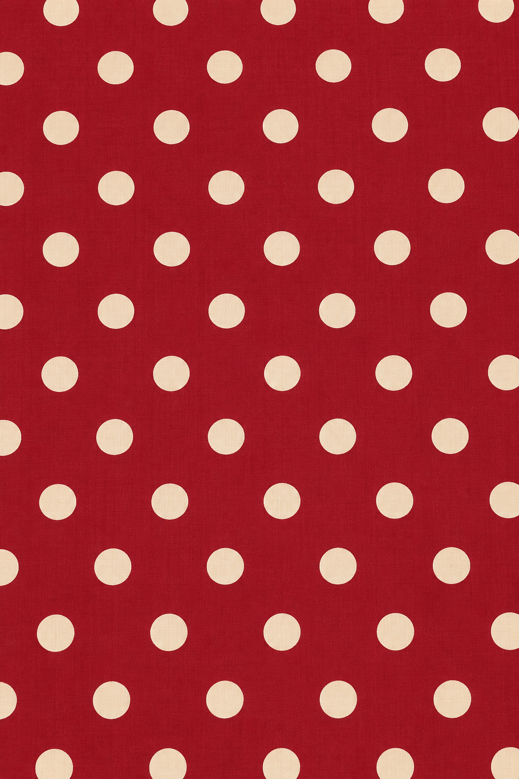 Maroon and cream polka dot fabric with a subtle woven textile texture