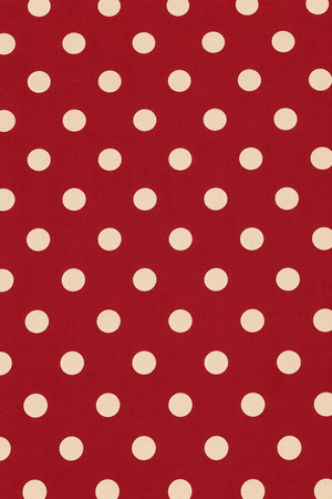 Maroon and cream polka dot fabric with a subtle woven textile texture