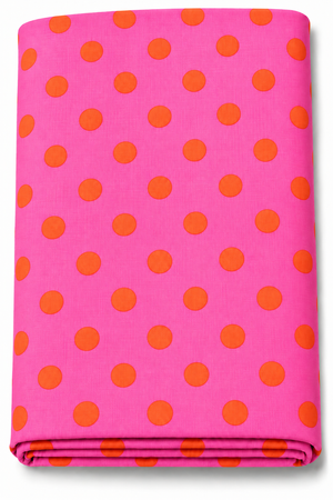 Hot pink fabric with bright orange polka dots folded for product display