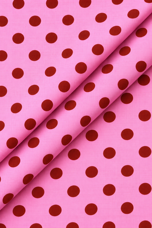 Pink and red polka dot fabric material for sewing and dressmaking