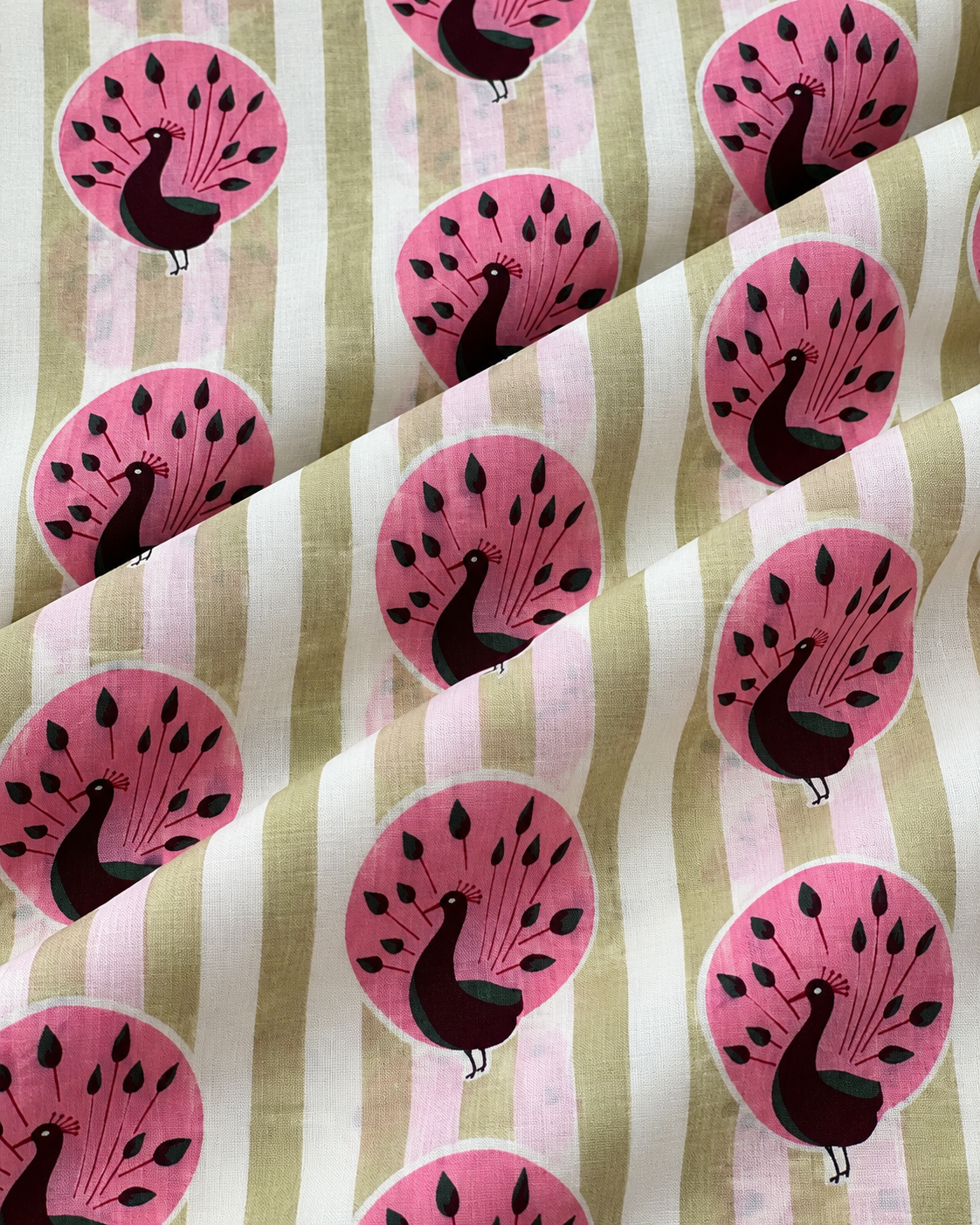 Elegant pink peacock printed cotton fabric for sewing and dressmaking projects.