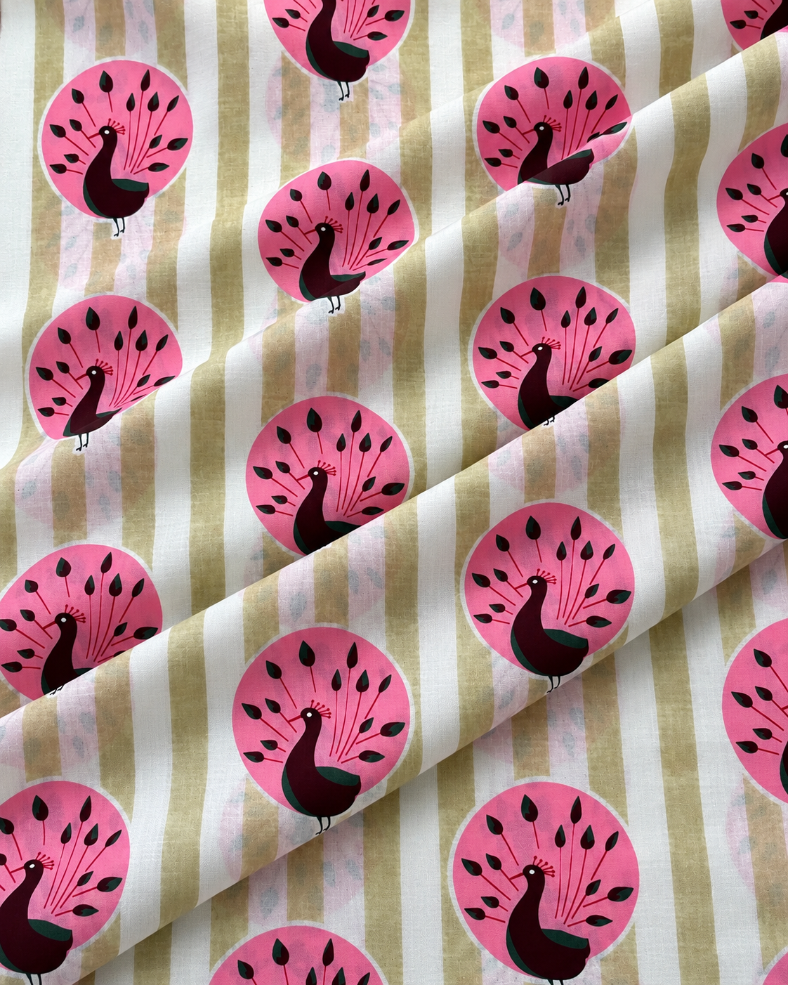 Beige and white striped cotton fabric featuring repeating pink peacock motifs.