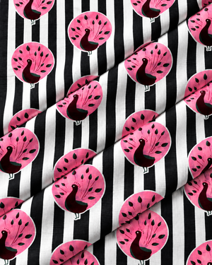 Folded black and white striped fabric featuring colorful pink peacock designs