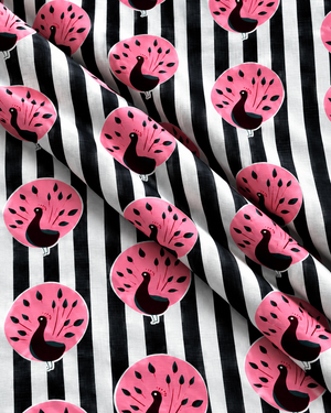 Printed cotton textile with black white stripes and pink peacock motifs showing fabric texture