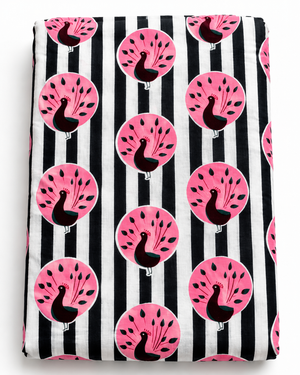 Black and white striped cotton fabric with repeating pink peacock print