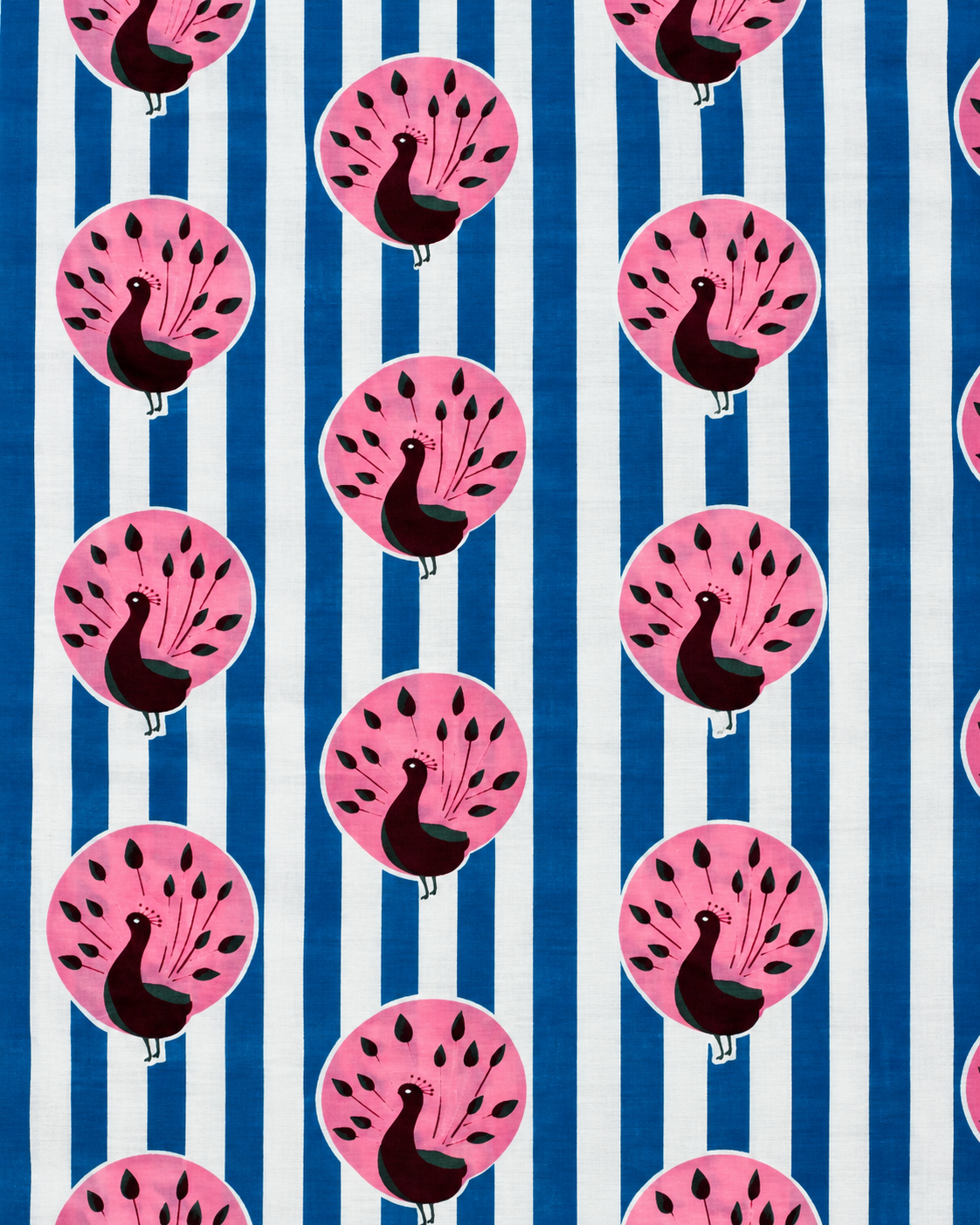 Close-up of pink peacock motifs on blue and white striped printed cotton fabric