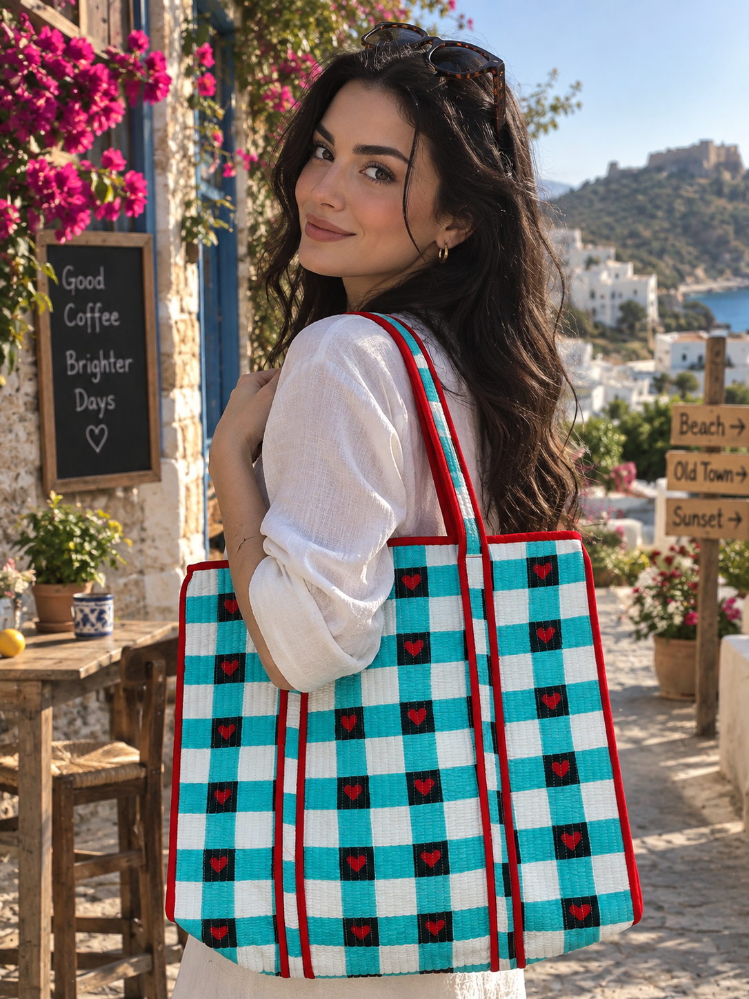 Colorful turquoise tote bag with black and red heart print