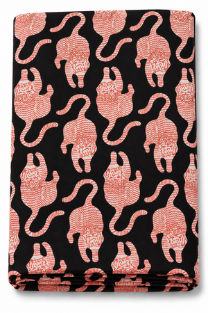 Black Tibetan tiger print fabric with white motifs