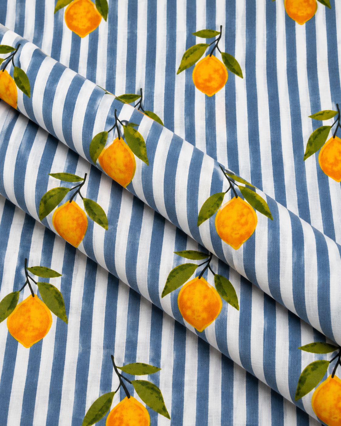 Yellow lemon and green leaf pattern on gray and white striped fabric