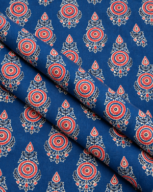 Dark blue fabric featuring repeating red and white traditional floral motifs