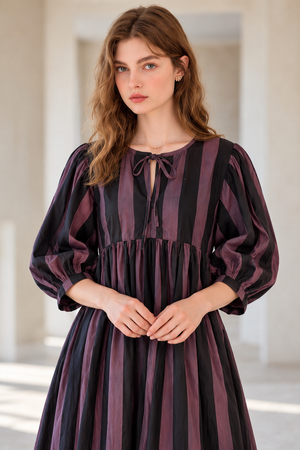 Elegant women's long dress with black and mauve vertical stripes
