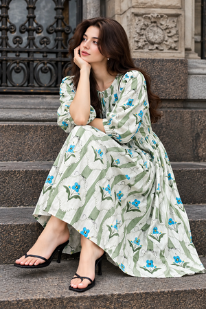 Women's floral maxi dress featuring three quarter style puff sleeves