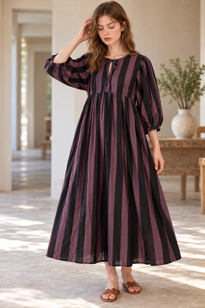 Elegant striped dress with a gathered waist and flowing skirt