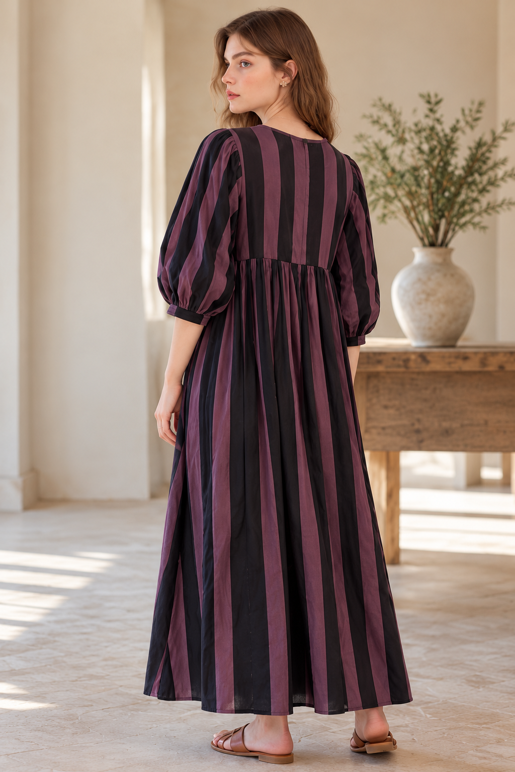 Full-length striped maxi dress with gathered waist and tie neckline
