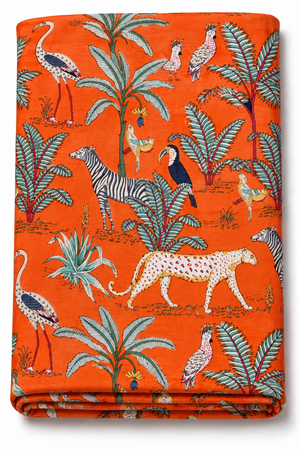 Orange jungle animal print fabric with tropical wildlife