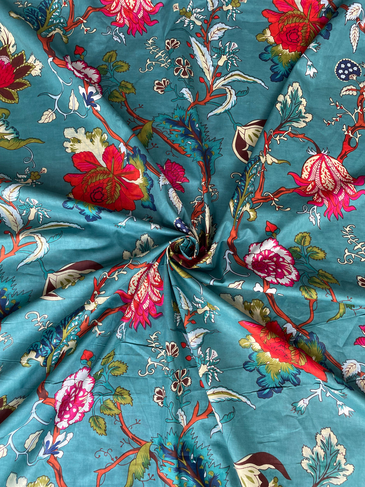 Teal cotton fabric with red pink and blue flowers