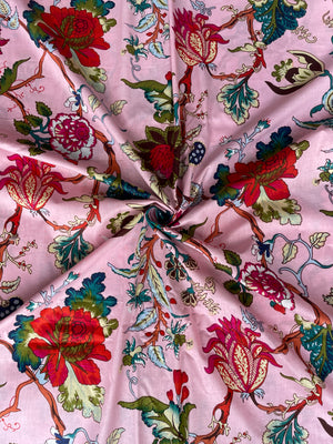 Colorful floral print cotton fabric on pink background