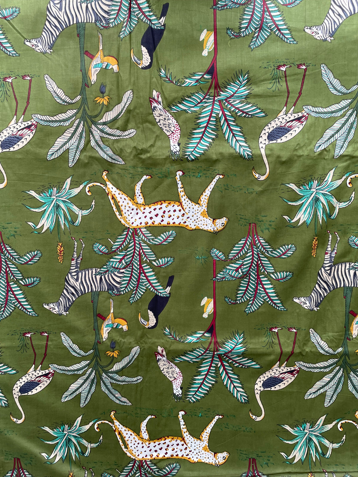 Jungle wildlife cotton fabric with tropical foliage