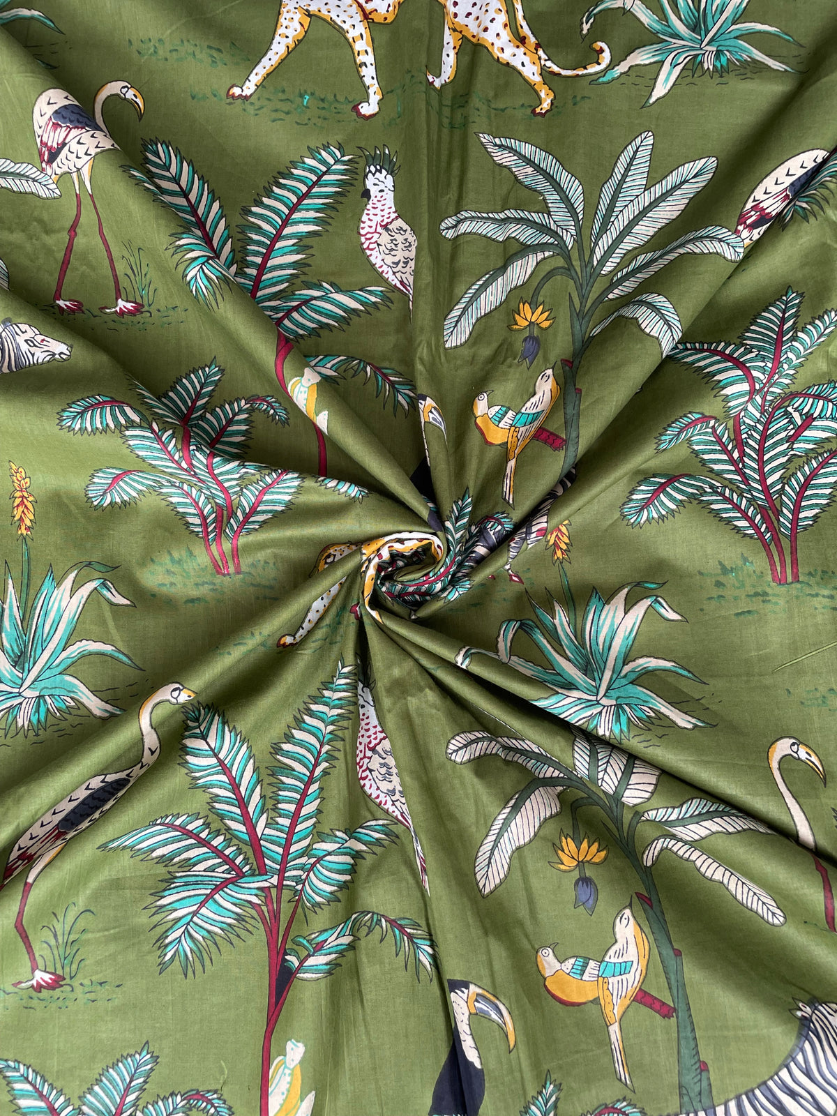 Green cotton fabric with zebra and leopard print