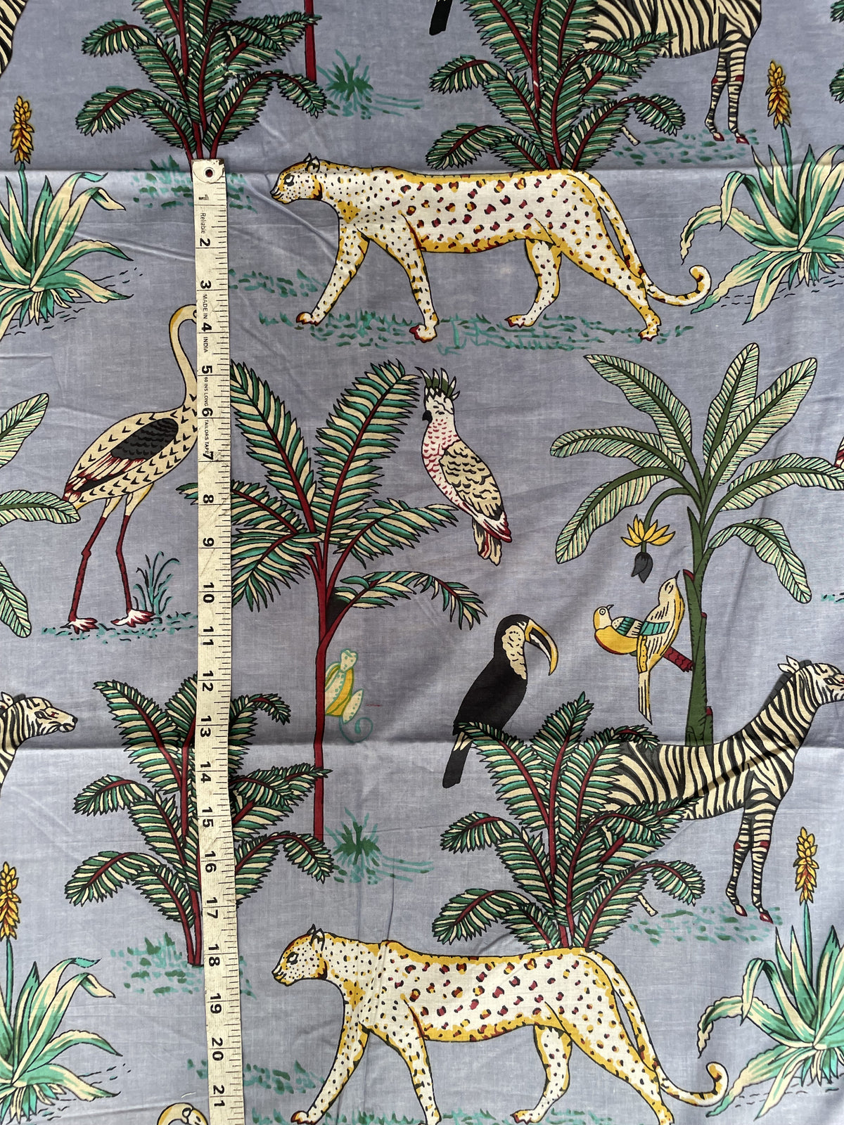 Jungle wildlife cotton fabric with tropical foliage