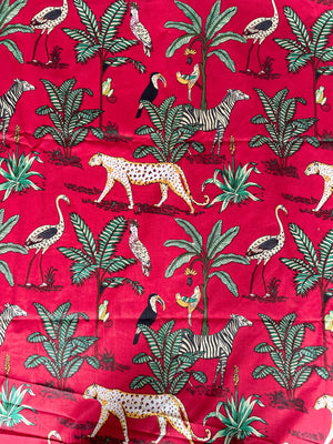 Tropical safari wildlife cotton fabric red background