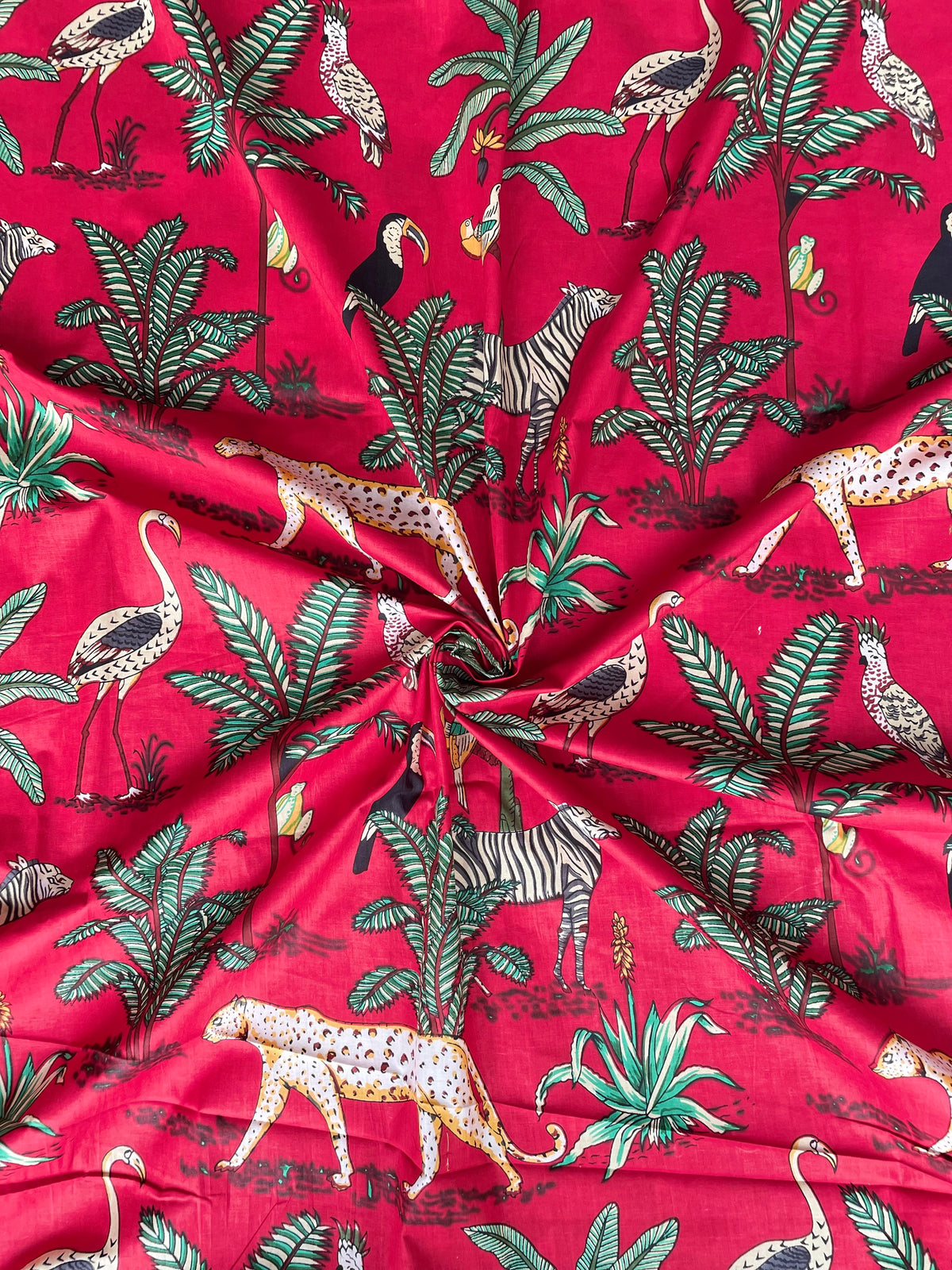 Red cotton fabric with zebra and leopard print