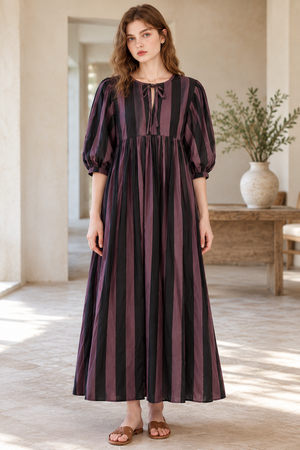 Women's flowing maxi dress with a delicate front tie detail