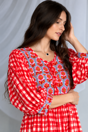 Red checkered maxi dress featuring three-quarter puff sleeves