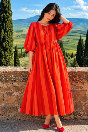 Red summer maxi dress styled with matching red heels