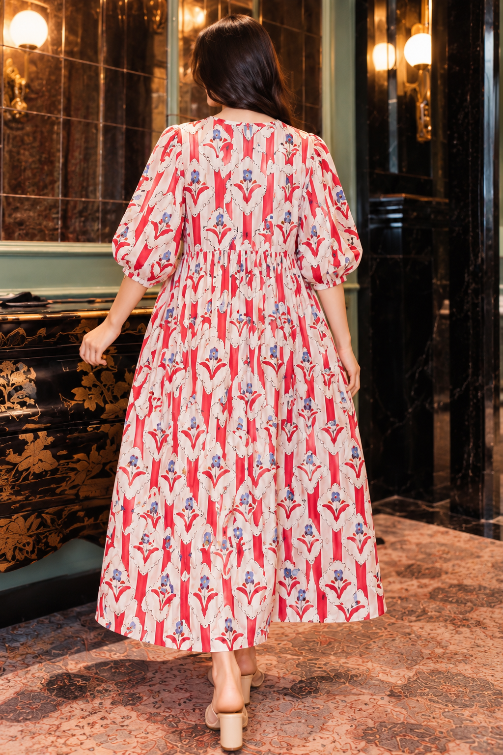 Women's long floral dress with gathered waist and flowing skirt